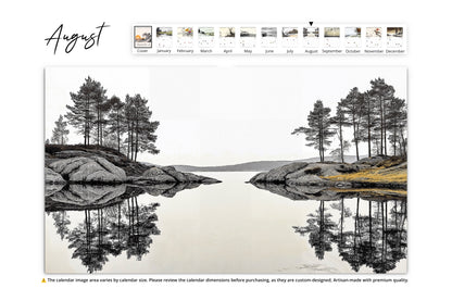 August page of the "Illustrated Moments" calendar displaying a serene mirrored reflection of trees and rocks on a still lake, emphasizing symmetry and tranquility.