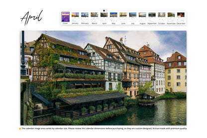 Traditional timber-framed houses covered in ivy by a calm canal in Strasbourg, France.