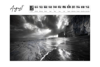 August calendar image of a dramatic seascape with dark, brooding clouds and waves washing up on a beach bordered by towering cliffs.