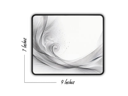 Artistic mouse pad displaying a 7x9 inch grayscale swirl pattern with delicate line work, representing minimalist style.