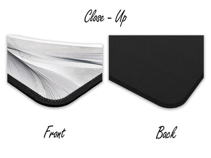 Close-up view of the mouse pads detailed grayscale design and texture, contrasted with its solid black rubber backing.