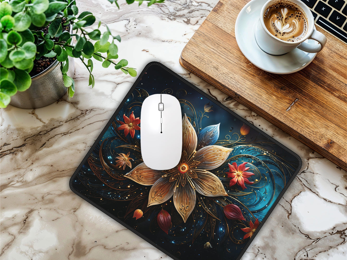 Workspace setup featuring the Celestial Bloom Mouse Pad and a white mouse, with a coffee cup and plant accents on a marbled desk.