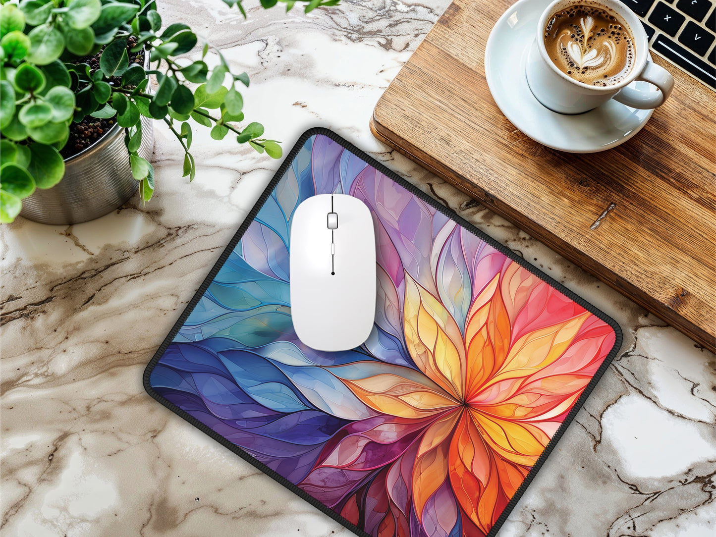 Mouse pad with an ethereal anime kingdom design, placed on a marbled surface beside a latte and laptop, illustrating its use.