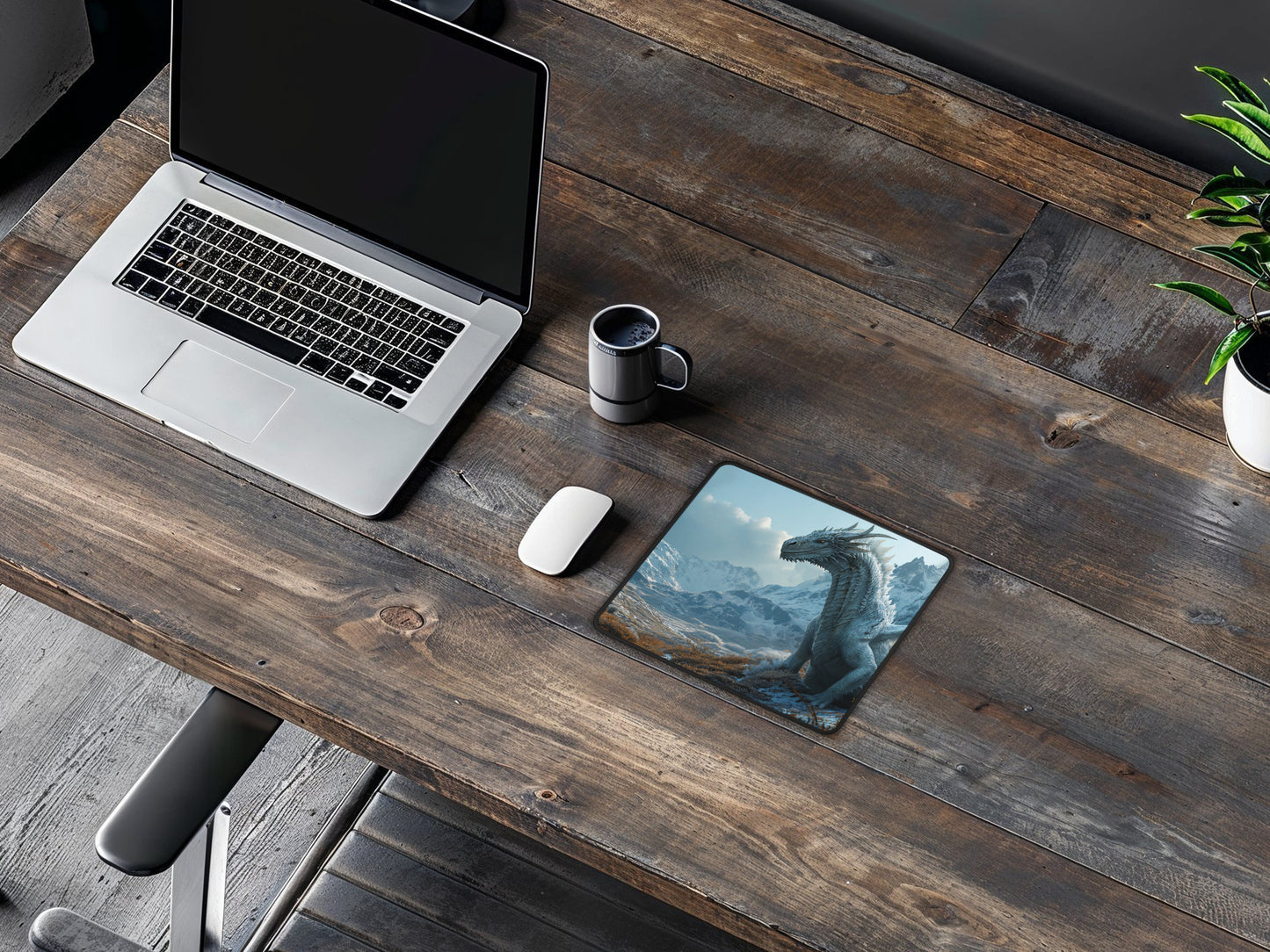 A warm and inviting workspace, featuring the Winter Dragon mouse pad as a centerpiece on a wood-finished desk.