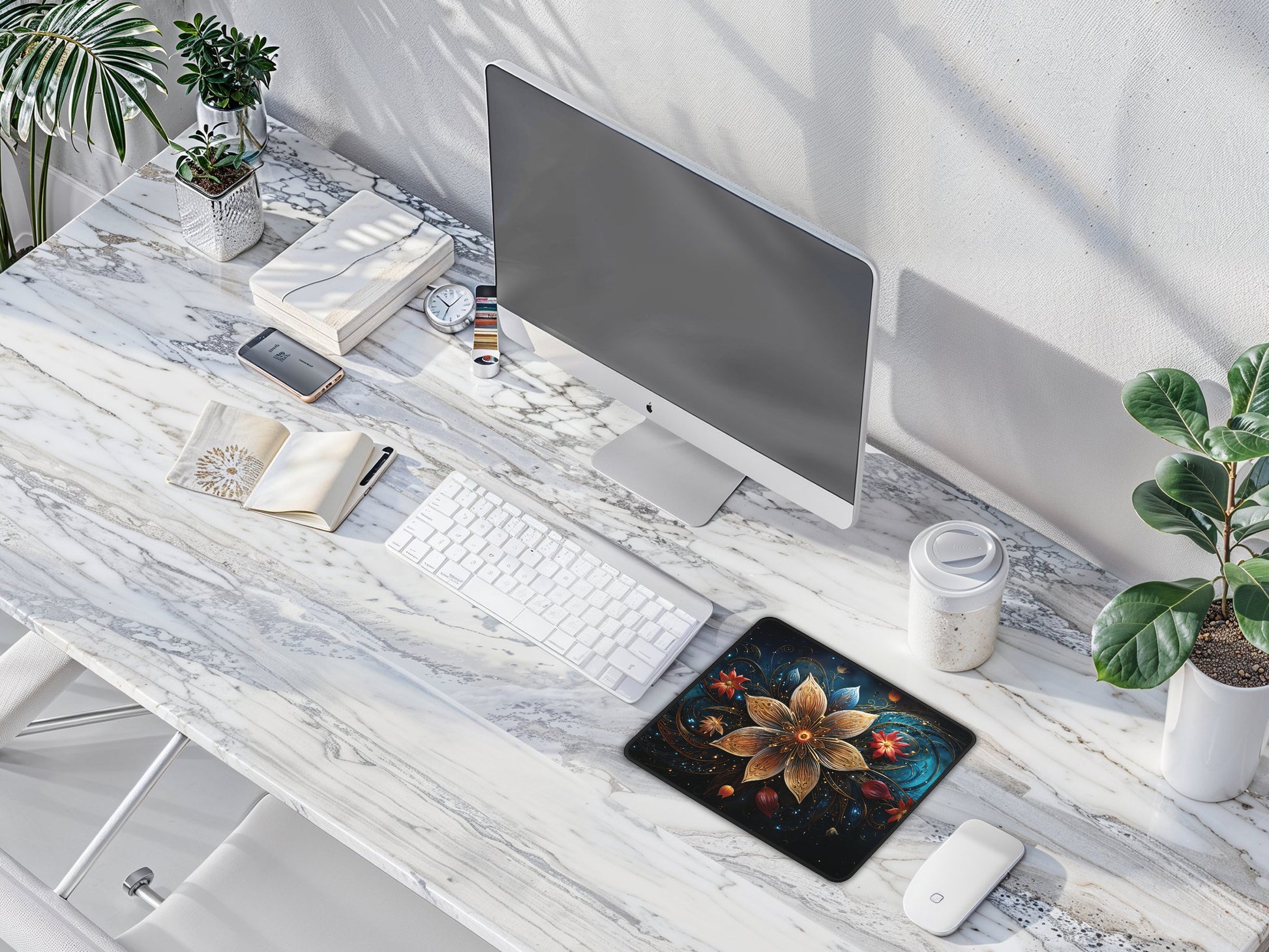 Minimalistic office desk featuring the Celestial Bloom Mouse Pad, complemented by a sleek monitor, white keyboard, and contemporary decor.