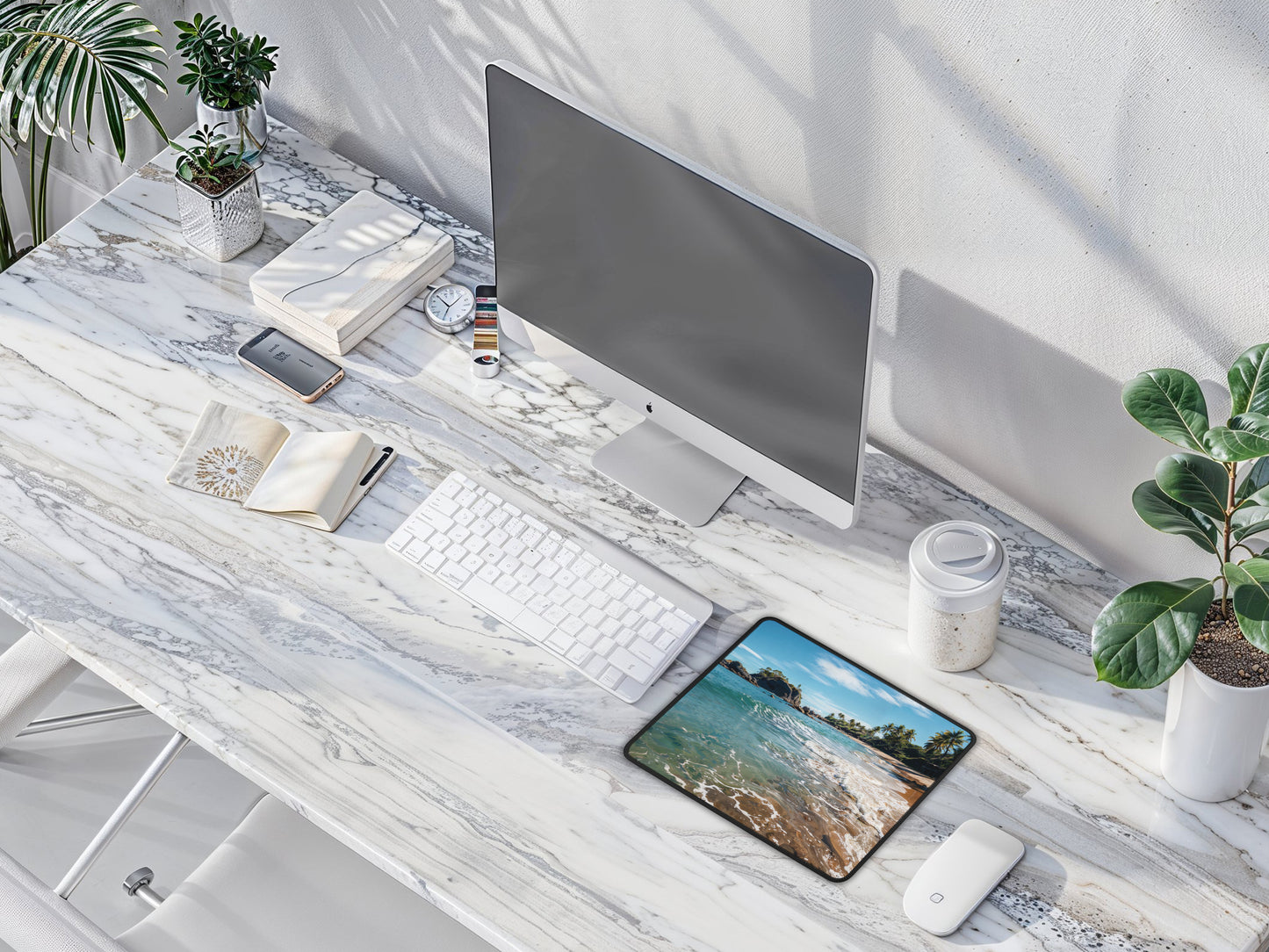 Bird-eye view of a minimalist work desk with the Thai Retreat mouse pad as the centerpiece, adding a touch of tranquility to the workday.