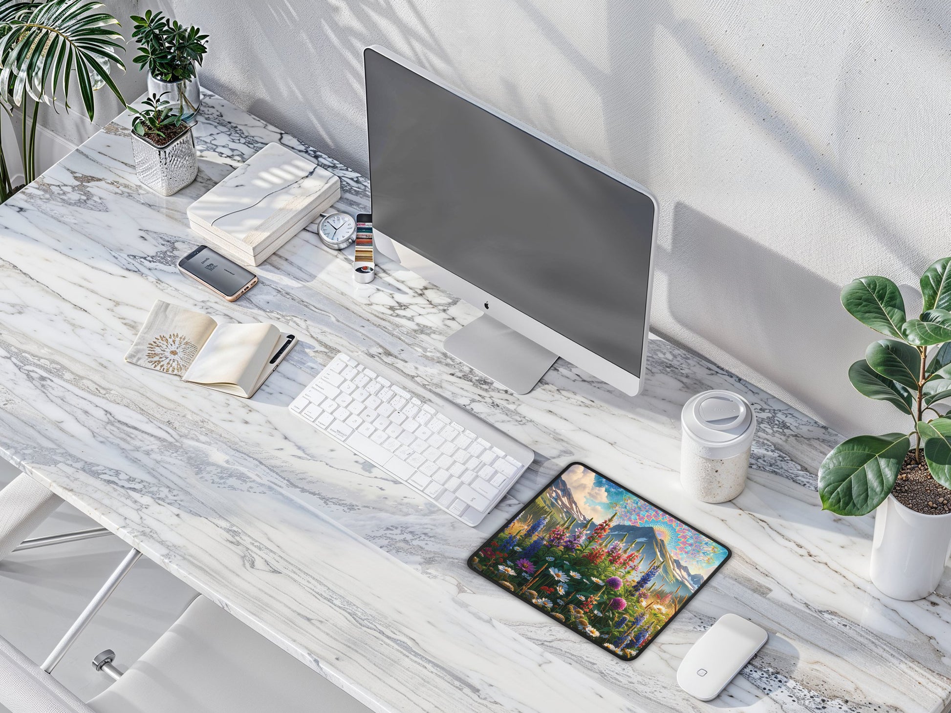 Elegant office setting with the mouse pad next to a desktop monitor, white keyboard, and mouse on a sleek white table, highlighting its artistic design.