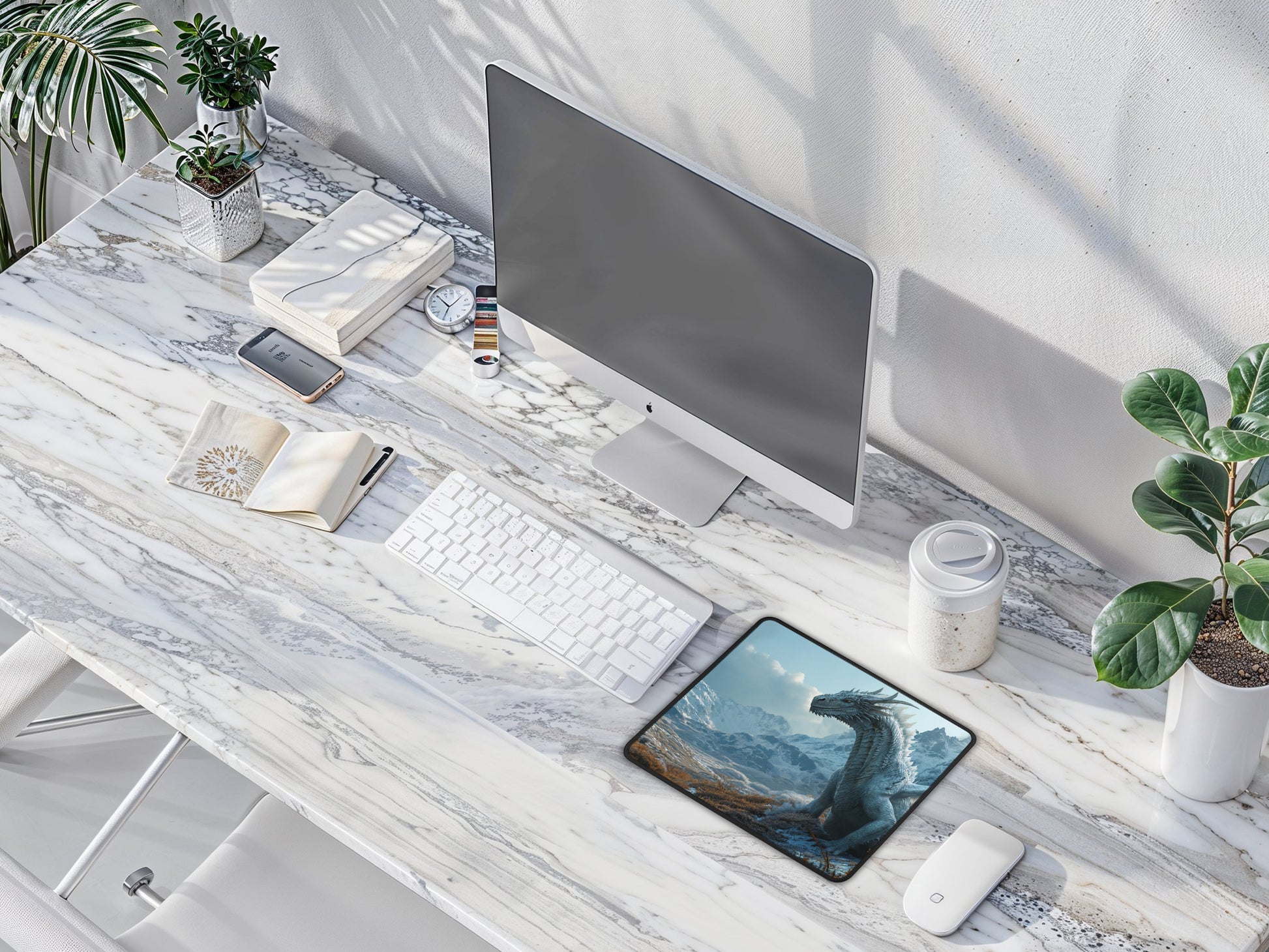 An elegant marble desk setup, where the Winter Dragon mouse pad adds a mythical ambiance to a chic and minimalist space.