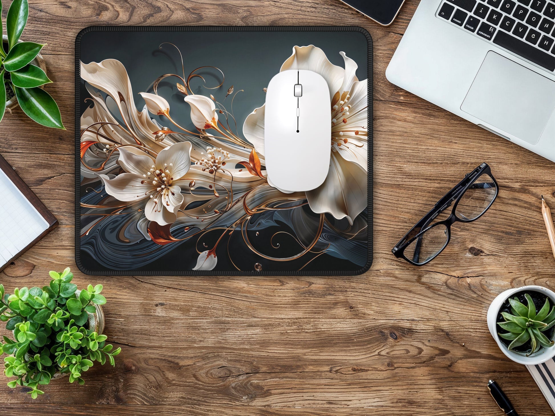 Desktop arrangement showcasing the Kaleidoscope Artisan Gaming Mouse Pad with a graceful floral pattern, creating an inviting atmosphere for work and play.