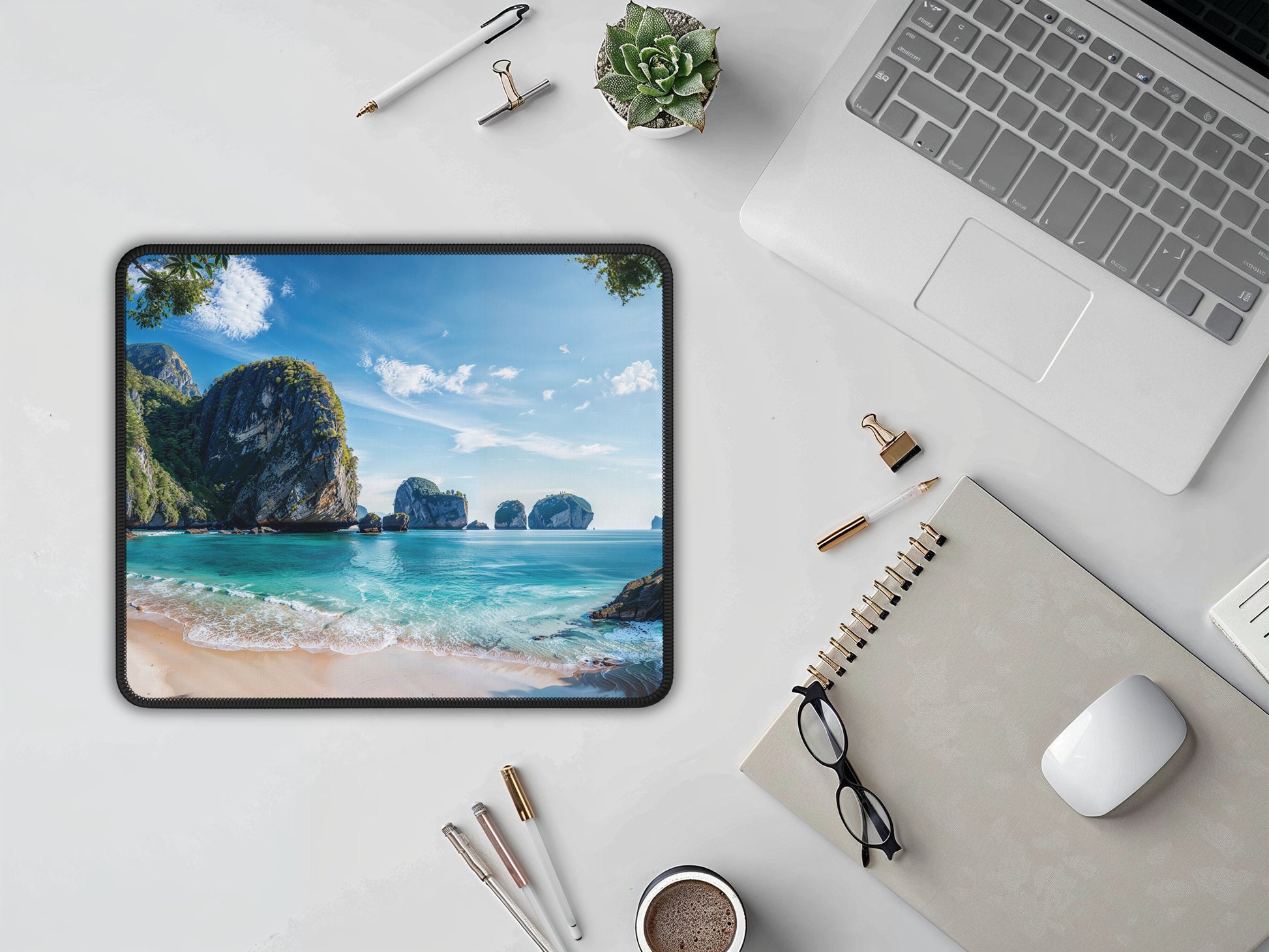 Clean and sophisticated workspace featuring the Thai beach mouse pad alongside a white mouse, notepad, and laptop, invoking a sense of calm.