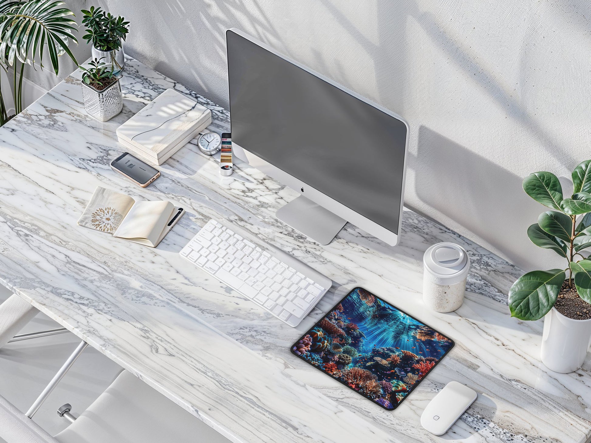 Mouse pad with a rich underwater scene of corals on a minimalist office desk, blending creativity with work.