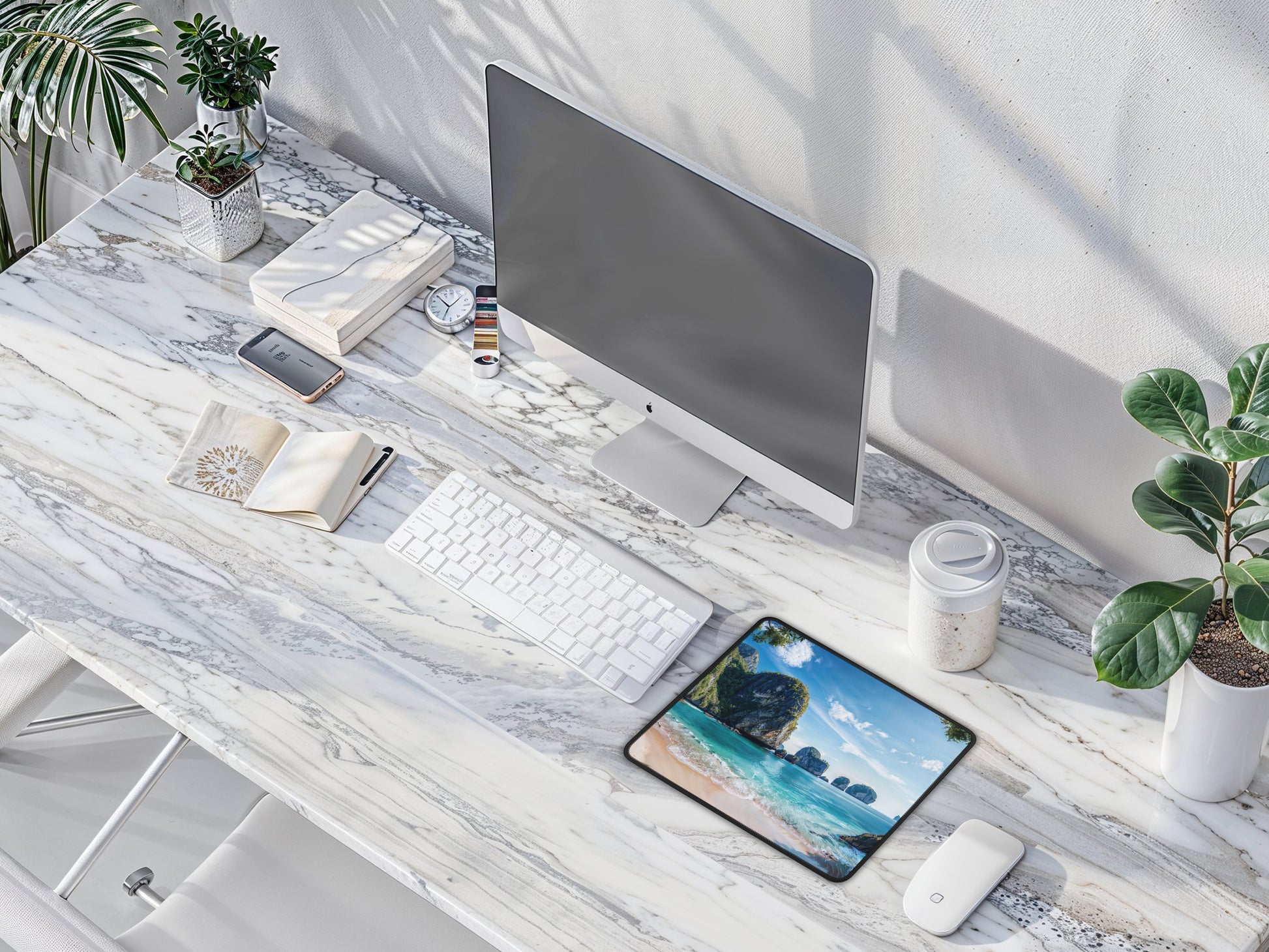 Aerial view of a minimalist desk setup with the artisan mouse pad, bringing a splash of Thai beach elegance to the modern workspace.