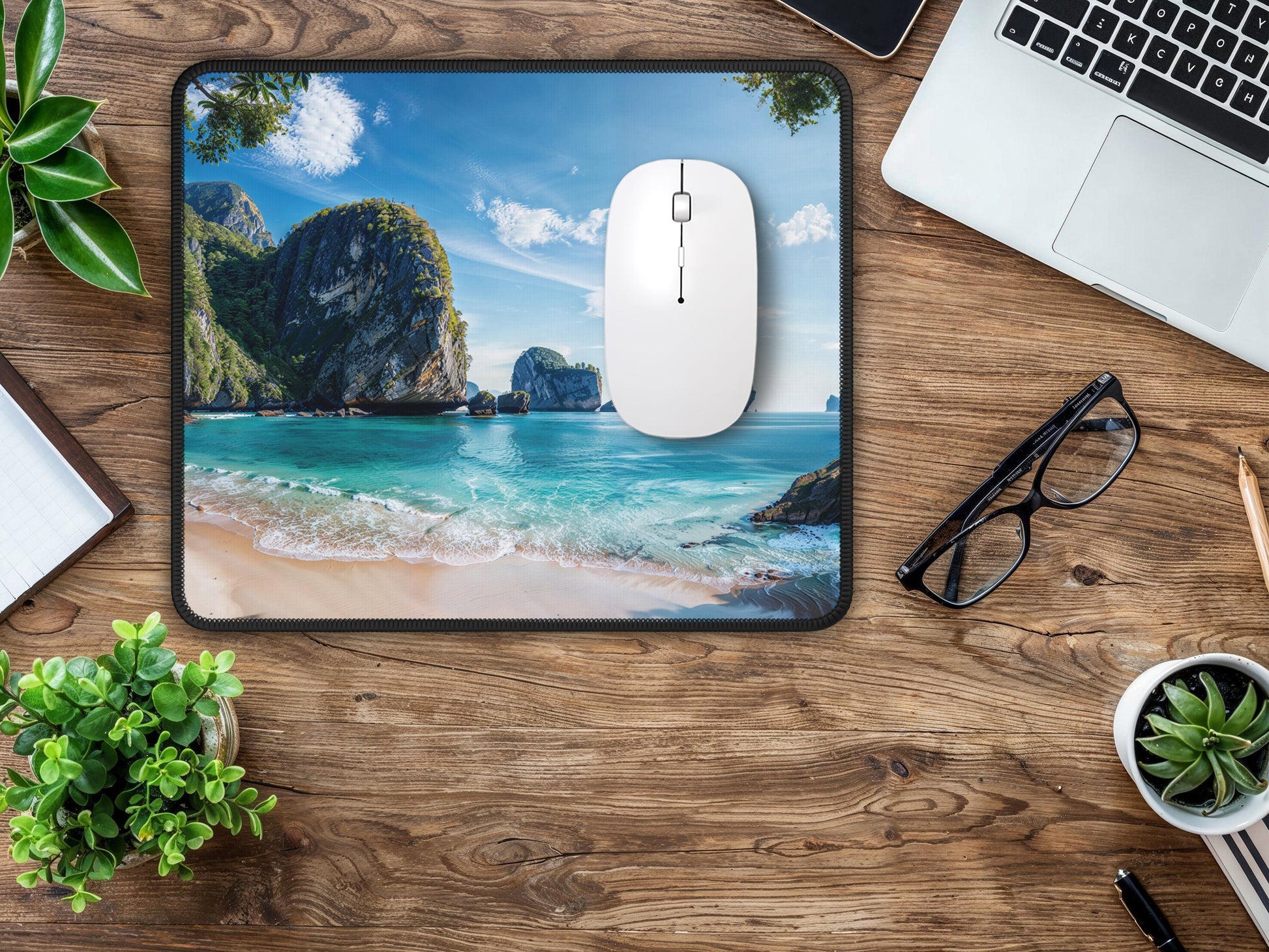 Mouse pad on a home office wood desk, the Thai beach print creating an inviting and peaceful computing environment.