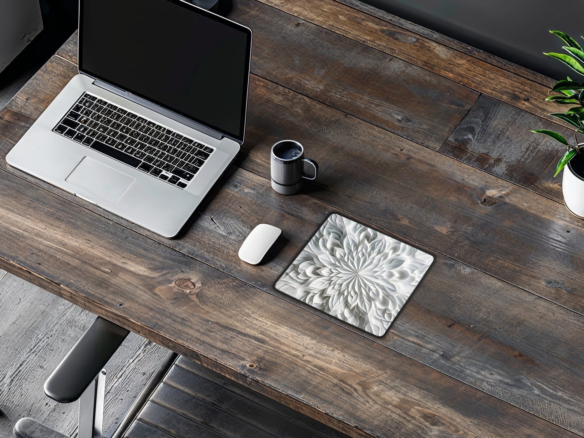 Artisan mouse pad on a wooden desk in a workspace, with the kaleidoscope pattern complementing the rustic setting.