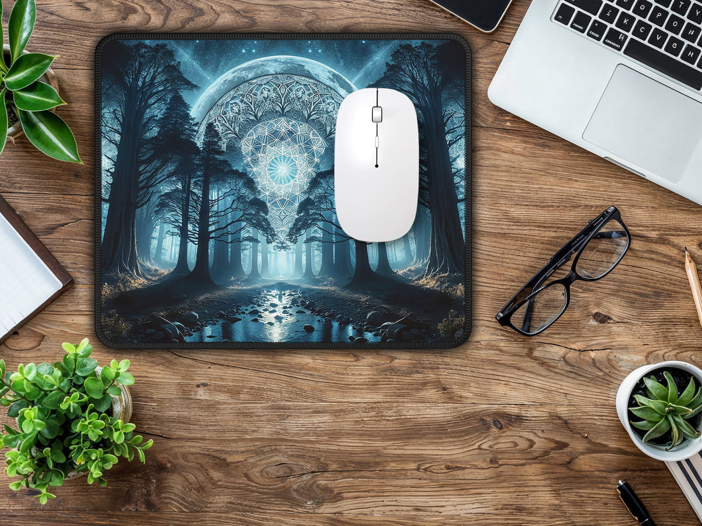 Workspace view showcasing the mouse pad with a mesmerizing moonlit forest scene, paired with office essentials.